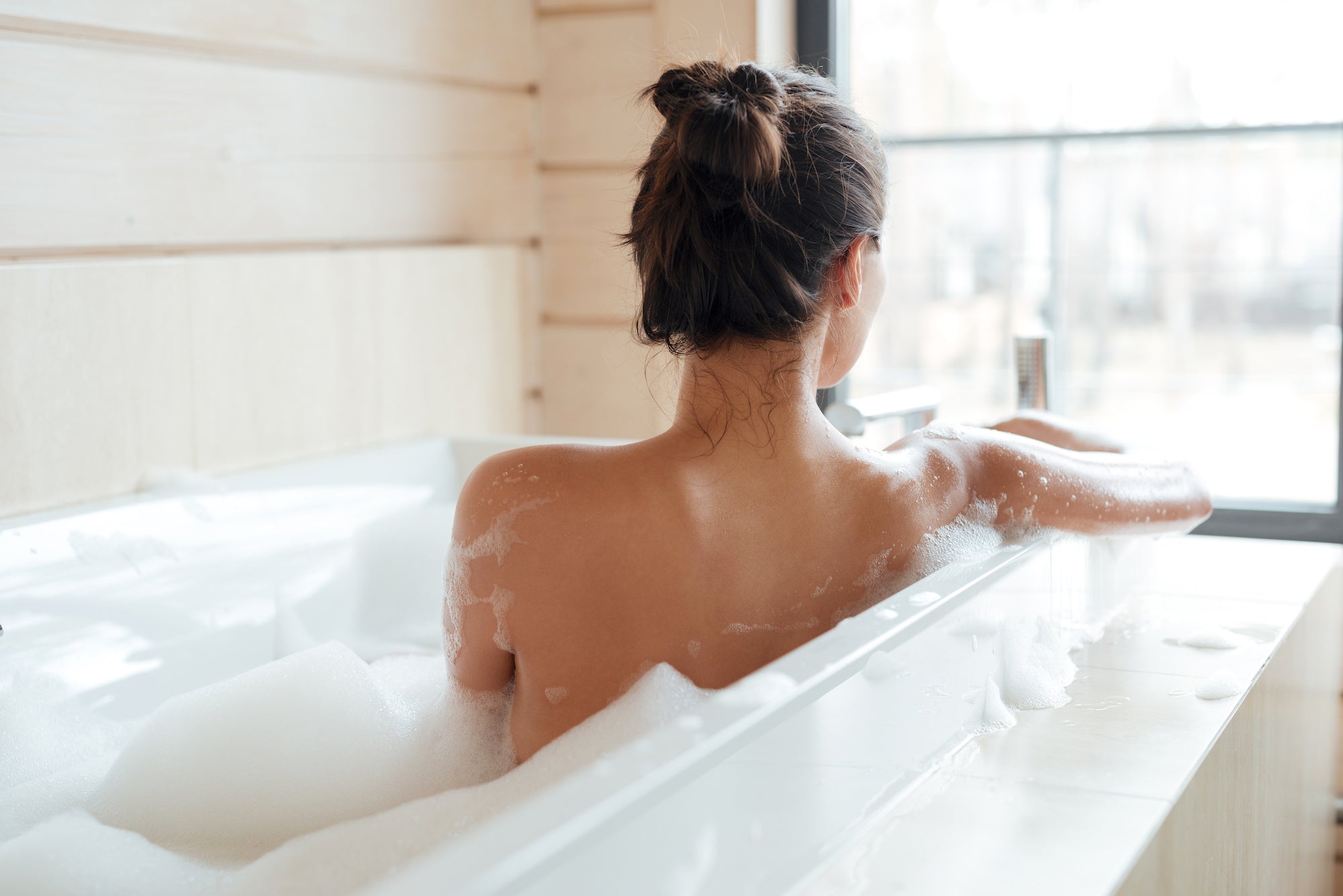 Woman enjoys bubble bath