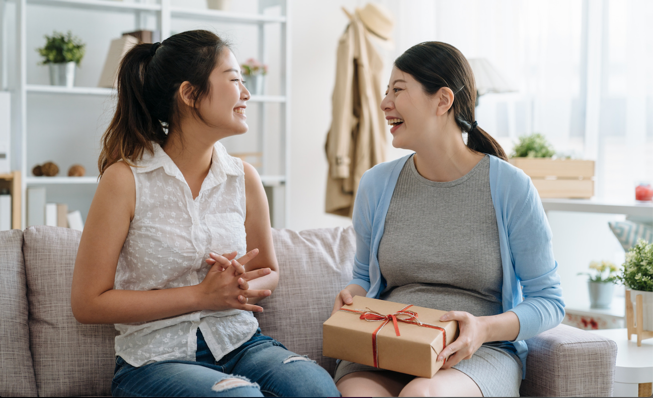 Two people giving each other skincare gifts